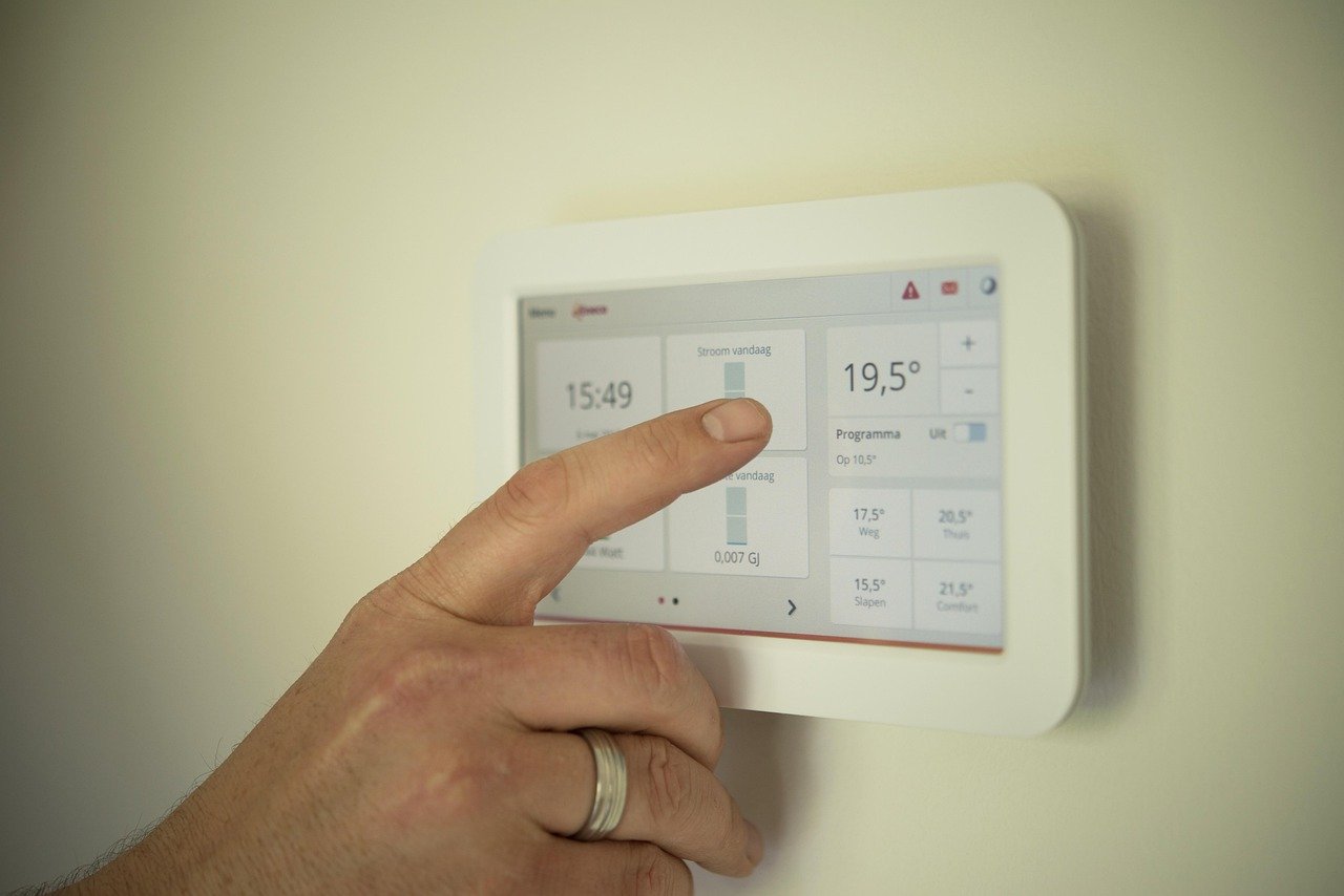 Person using smart home app to control air quality devices